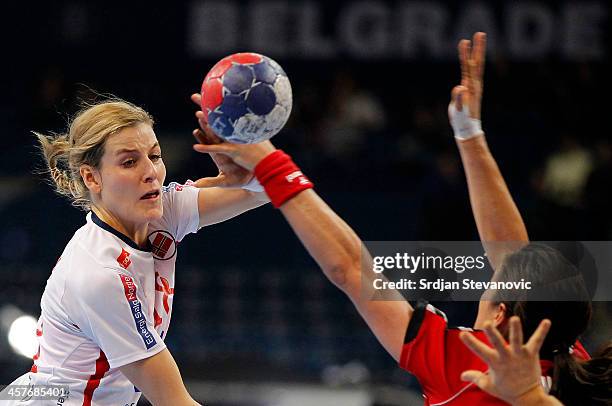 Karoline Dyhre Breivang of Norway competes for the ball with Sanja Damnjanovic of Serbia during the 2013 World Women's Handball Championship 2013...