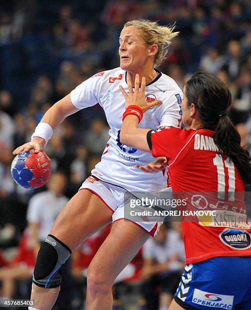 Norway's Ida Alstad vies with Serbia's Sanja Damnjanovic during their Women's 2013 Handball World Championship quarter final match between Serbia and...
