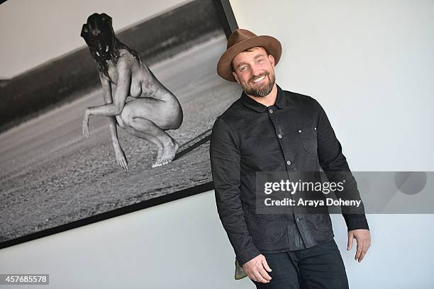 Photographer Brian Bowen Smith poses for a portrait session at De Re Gallery on October 22, 2014 in West Hollywood, California.