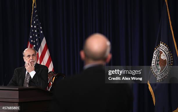 Federal Reserve Board Chairman Ben Bernanke listens to a question during a news conference after a Federal Open Market Committee meeting December 18,...