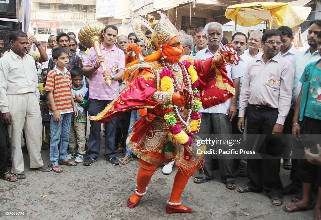 A Hindu devotee dressed as a "Monkey God Hanuman"...