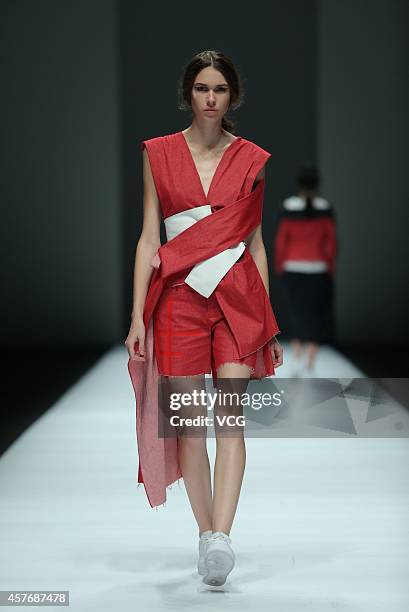 Model showcases designs on the runway at Haizhen Wang show during the Shanghai Fashion Week 2015 Spring/Summer on October 22, 2014 in Shanghai, China.