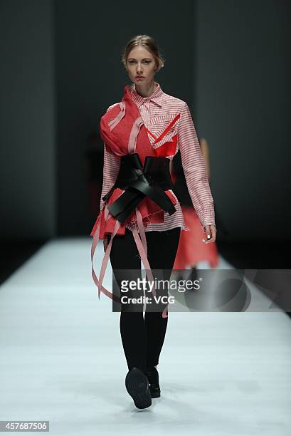 Model showcases designs on the runway at Haizhen Wang show during the Shanghai Fashion Week 2015 Spring/Summer on October 22, 2014 in Shanghai, China.