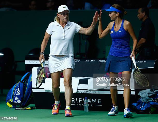 Martina Navratilova of USA and Iva Majoli of Croatia in their legends match against Marion Bartoli of France and Tracy Austin of USA during day three...