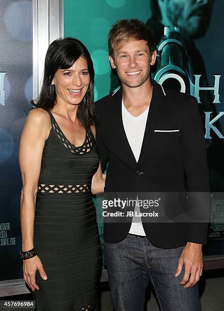 Perrey Reeves and Aaron Fox attend Summit Entertainment's premiere of 'John Wick' at the ArcLight Theater on October 22, 2014 in Hollywood,...