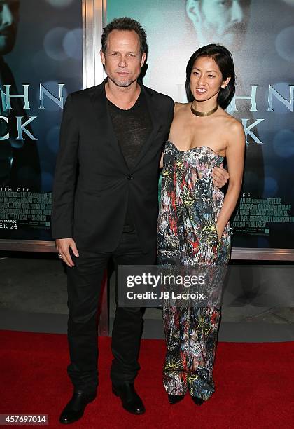 Dean Winters and Fannie Chan attend Summit Entertainment's premiere of 'John Wick' at the ArcLight Theater on October 22, 2014 in Hollywood,...