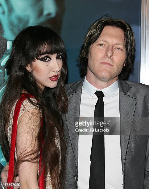 Ciscandra Nostalghia and Tyler Bates attend Summit Entertainment's premiere of 'John Wick' at the ArcLight Theater on October 22, 2014 in Hollywood,...
