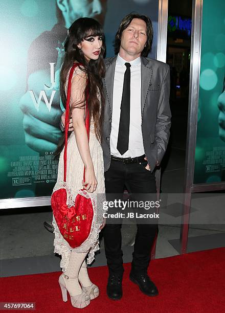 Ciscandra Nostalghia and Tyler Bates attend Summit Entertainment's premiere of 'John Wick' at the ArcLight Theater on October 22, 2014 in Hollywood,...