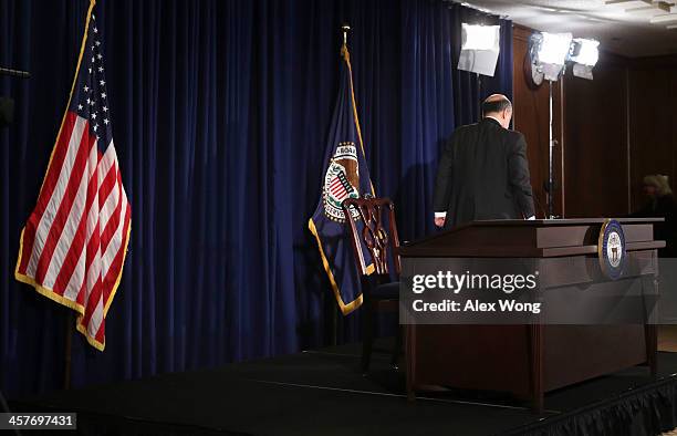 Federal Reserve Board Chairman Ben Bernanke leaves after a news conference after a Federal Open Market Committee meeting December 18, 2013 at the...