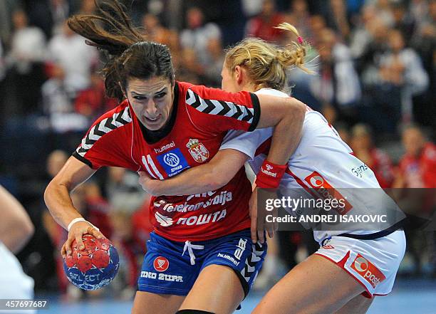 Serbia's Sanja Damnjanovic vies with Norway's Ida Alstad during their Women's 2013 Handball World Championship quarter final match between Serbia and...