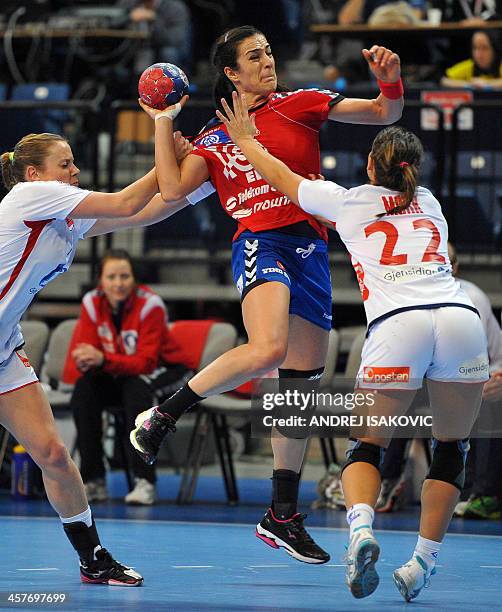 Serbia's Sanja Damnjanovic vies with Norway's Tonje Nostvold and Nora Mork during their Women's 2013 Handball World Championship quarter final match...