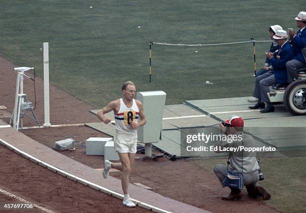 English long distance runner Basil Heatley of the Great Britain team, en route to winning the silver medal in the Men's marathon event at the 1964...