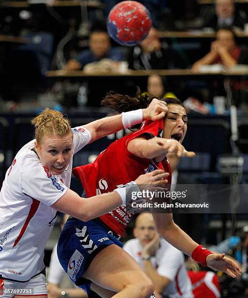 Sanja Damnjanovic of Serbia is challenged by Karoline Dyhre Breivang of Norway during the 2013 World Women's Handball Championship 2013 match between...