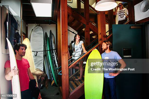 From left bottom row, Evan Daniel, product designer, Tasha Woodworth, associate designer, and Paul Hendricks, brand responsibility analyst, grab...