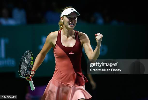 Caroline Wozniacki of Denmark celebrates defeating Agnieszka Radwanska of Poland during day four of the BNP Paribas WTA Finals tennis at the...