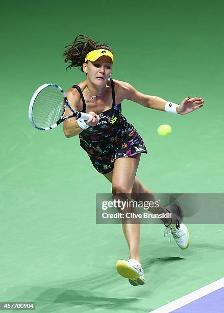 Agnieszka Radwanska of Poland in action against Caroilne Wozniacki of Denmark in their round robin match during the BNP Paribas WTA Finals at...