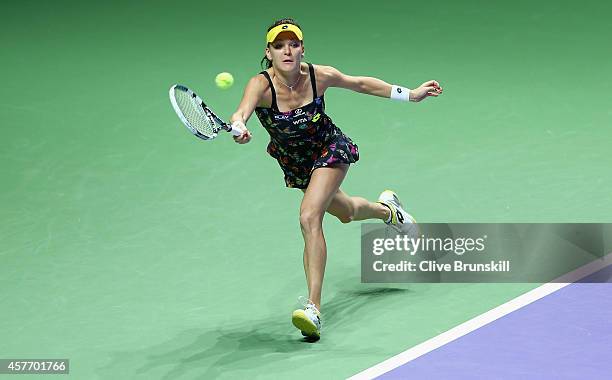 Agnieszka Radwanska of Poland stretches for a forehand against Caroilne Wozniacki of Denmark in their round robin match during the BNP Paribas WTA...