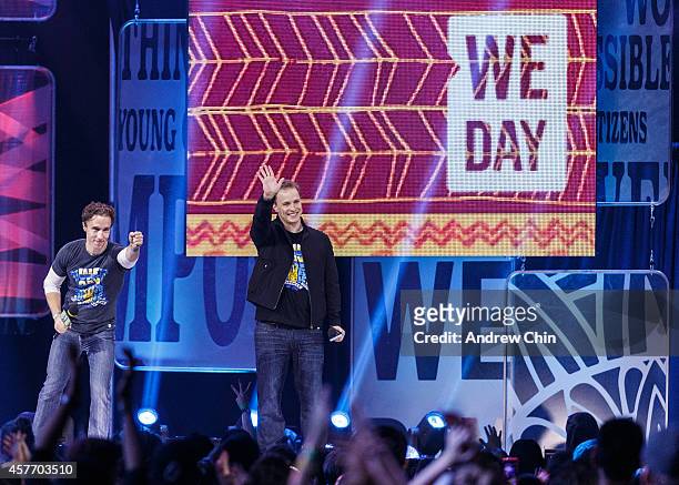 Craig and Marc Kielburger, international activists and co-founders of We Day speak during 'We Day Vancouver' at Rogers Arena on October 22, 2014 in...