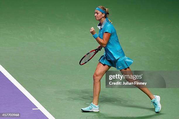 Petra Kvitova of Czech Republic celebrates winning a game against Maria Sharapova of Russia during day four of the BNP Paribas WTA Finals tennis at...