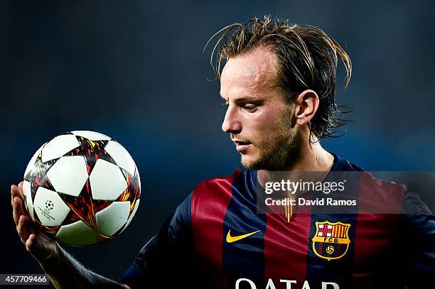 Ivan Rakitic of FC Barcelona grabs the ball during a UEFA Champions League Group F match between FC Barcelona and AFC Ajax at the Camp Nou Stadium on...