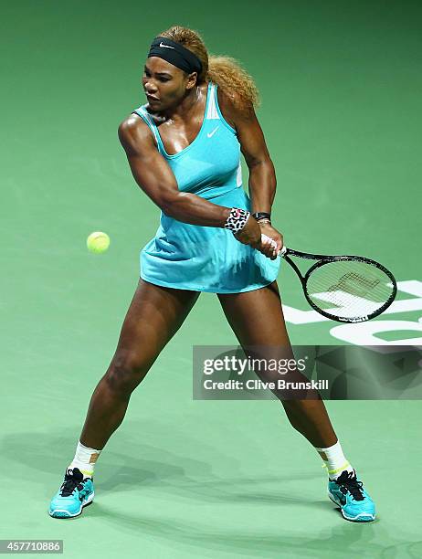 Serena Williams of the United States plays a backhand against Eugenie Bouchard of Canada in their round robin matchduring the BNP Paribas WTA Finals...