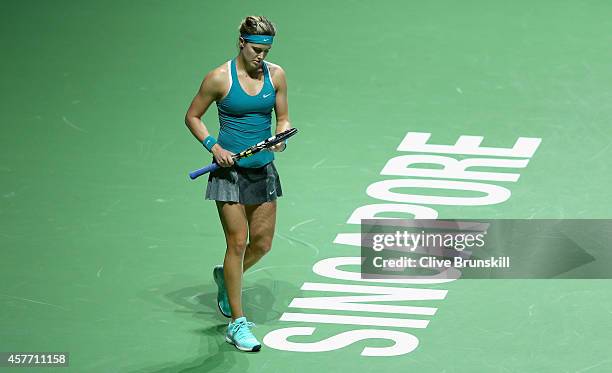 Eugenie Bouchard of Canada shows her dejection against Serena Williams of the United States in their round robin match during the BNP Paribas WTA...