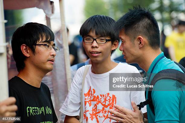 Hong Kong Federation of Students secretary general Alex Chow Yong-kang , Students' association Scholarism founder Joshua Wong Chi-fung and a police...