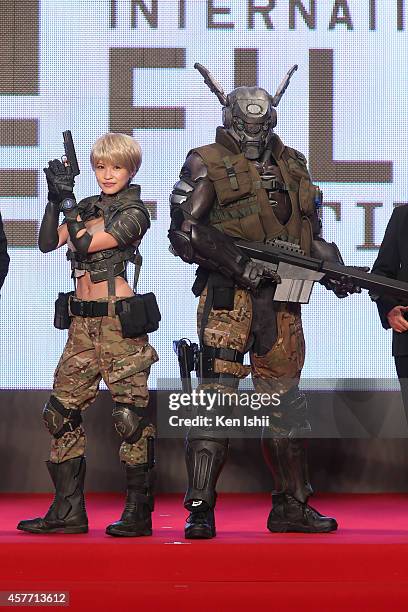 Actress Asuka Kishi and cartoon character pose for 'Appleseed Alpha' photocall during the opening ceremony during the 27th Tokyo International Film...