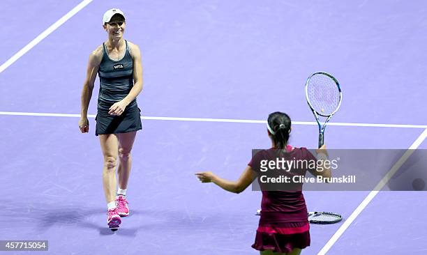 Cara Black of Zimbabwe and Sania Mirza of India celebrate match point against Abigail Spears and Raquel Kops-Jones of the United States in their...