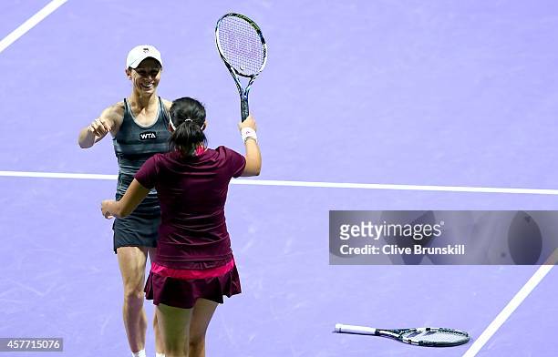 Cara Black of Zimbabwe and Sania Mirza of India celebrate match point against Abigail Spears and Raquel Kops-Jones of the United States in their...