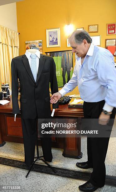 Roberto Espinola, owner of a chain of tailor shops in Paraguay, who launched a line of pocketless men suits to be worn as a protest against...