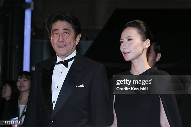 Shinzo Abe, Japanese Prime Minister and actress Miki Nakatani arrive at the opening ceremony during the 27th Tokyo International Film Festival at...