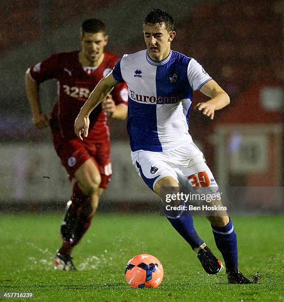 Tom Lockyer of Bristol advances with the ball under pressure from Mark Connolly of Crawley during the FA Cup Second Round Replay match between...