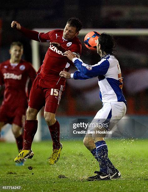 Danny Bullman of Crawley wins an aerial ball ahead of Tom Lockyer of Bristol Rovers during the FA Cup Second Round Replay match between Crawley Town...