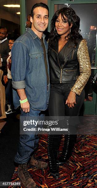 Gabe Solis and Trinda Braxton attend the "Grudge Match" screening at AMC Parkway Pointe on December 17, 2013 in Atlanta, Georgia.