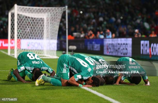 Mohsine Moutaouali of Raja Casablanca celebrates with team mates after scoring from the penalty spot during the FIFA Club World Cup Semi Final match...