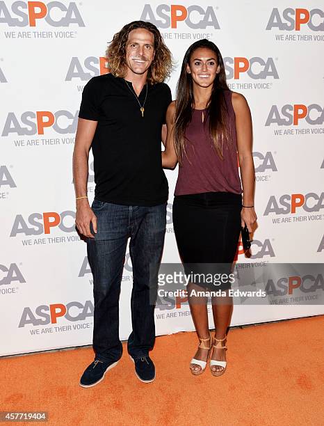Volleyball players Jeremy Casebeer and Geena Urango arrive at the ASPCA cocktail party honoring Kaley Cuoco-Sweeting and Nikki Reed with ASPCA...