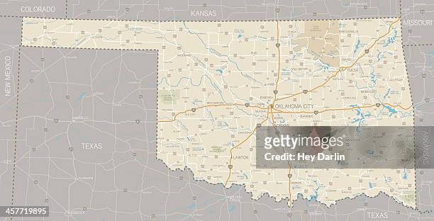 a segmented map of oklahoma next to texas - oklahoma stock illustrations