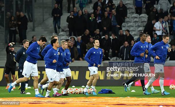 Everton's players warm up before the UEFA Europa League Group H football match LOSC Lille vs Everton FC at Pierre Mauroy Stadium in...