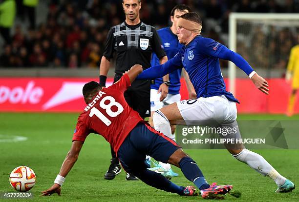 Everton's British Midefielder Ross Barkley vies for the ball with Lille's French defender Franck Beria during the UEFA Europa League Group H football...