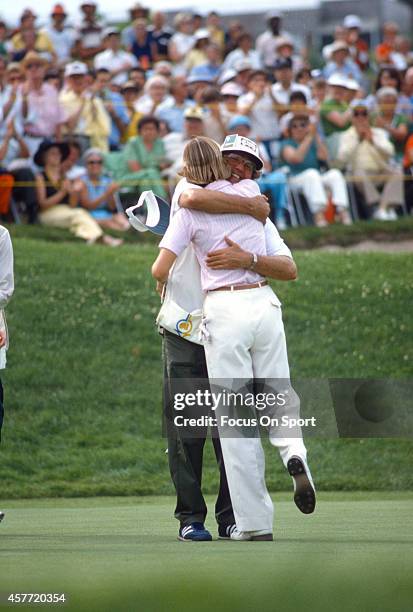 Women's golfer Beth Daniel hugs her catty during tournament play circa 1980.