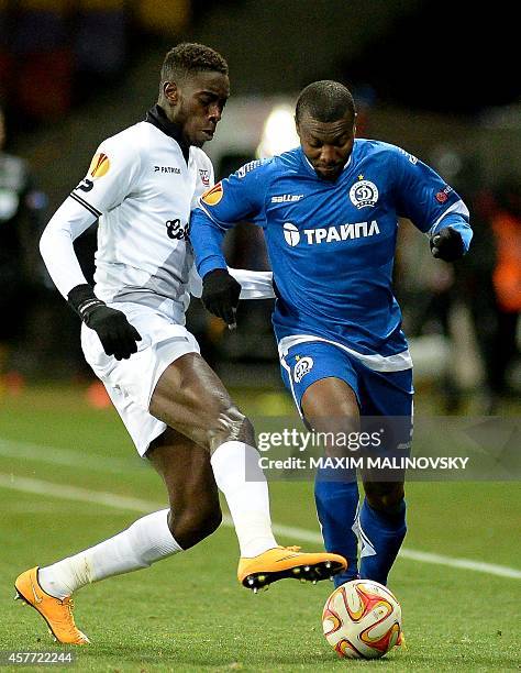 Dinamo Minsk's Franck Dja Djedje vies for a ball with Guingamp Sambou Yatabare during the UEFA Europa League Group K football match between Dinamo...