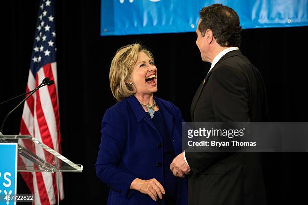 Former U.S. Secretary of State and U.S. Sen. Hillary Rodham Clinton and incumbent New York Governor Andrew Cuomo laugh during a "Women for Cuomo"...