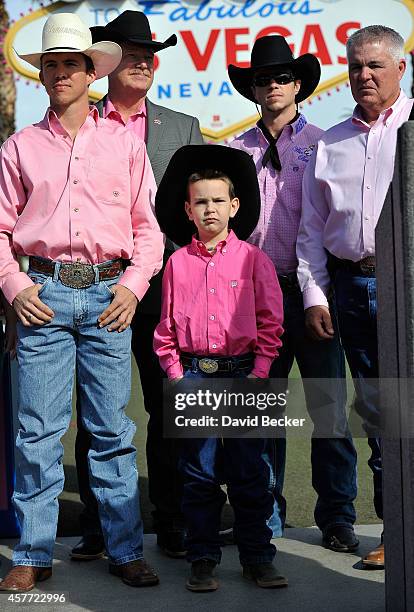 Bull rider Jason Malone, Professional Bull Riders Chairman and CEO Jim Haworth, Jaxson Kidd, bull rider Cody Nance and Kidd's father, Patrick Kidd,...