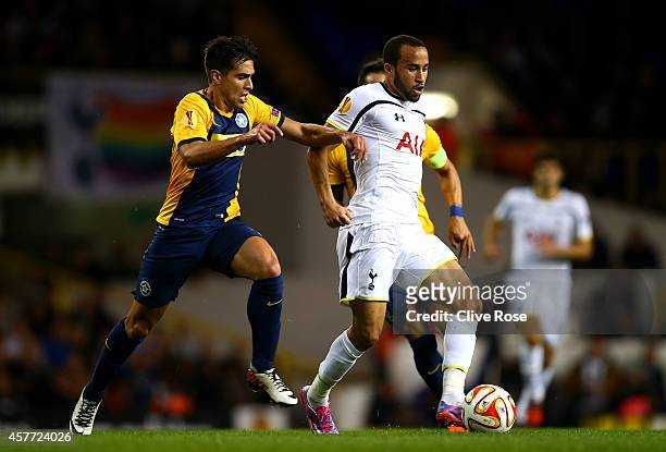 Andros Townsend of Spurs passes the ball under pressure from Juan Munafo of Asteras Tripolis FC during the UEFA Europa League group C match between...