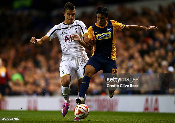 Erik Lamela of Spurs battles for the ball with Braian Lluy of Asteras Tripolis FC during the UEFA Europa League group C match between Tottenham...
