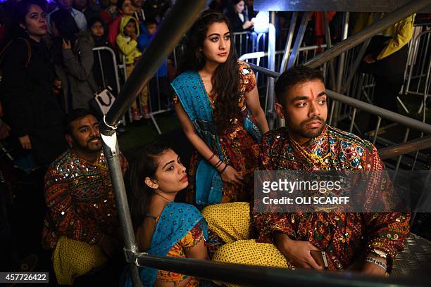 Members of De Montfort University's 'Bollywood Dance Society' wait to perform on stage as part of the Diwali celebrations near Leicester's Golden...