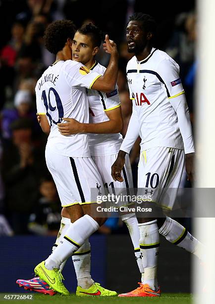 Erik Lamela of Spurs celebrates with team-mates Emmanuel Adebayour and Mousa Dembele after scoring his team's third goal during the UEFA Europa...