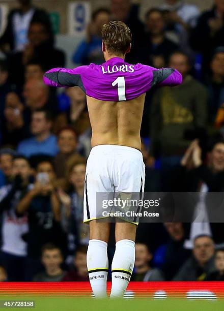 Harry Kane of Spurs pulls on the goalkeeper's shirt of team-mate Hugo Lloris after he was sent off during the UEFA Europa League group C match...
