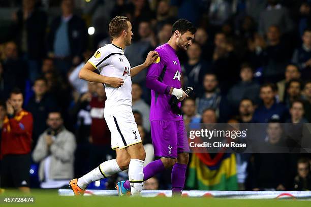 Harry Kane of Spurs speaks with team-mate Hugo Lloris as he volunteers to go in goal following Lloris' sending off during the UEFA Europa League...